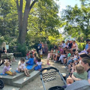 Families gathered outdoors for Storytime at 577.